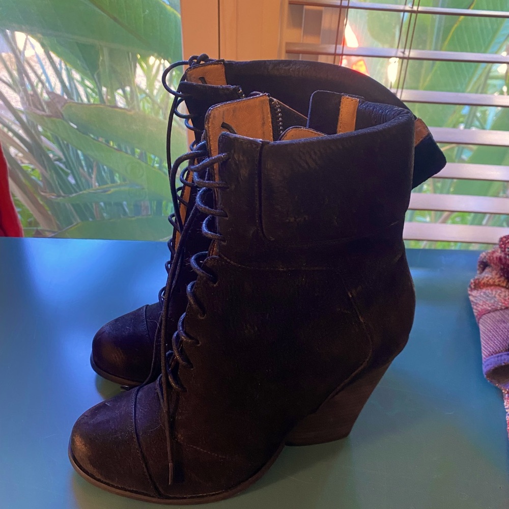 Black suede leather high heel lace up boots. Brand new. Never won.